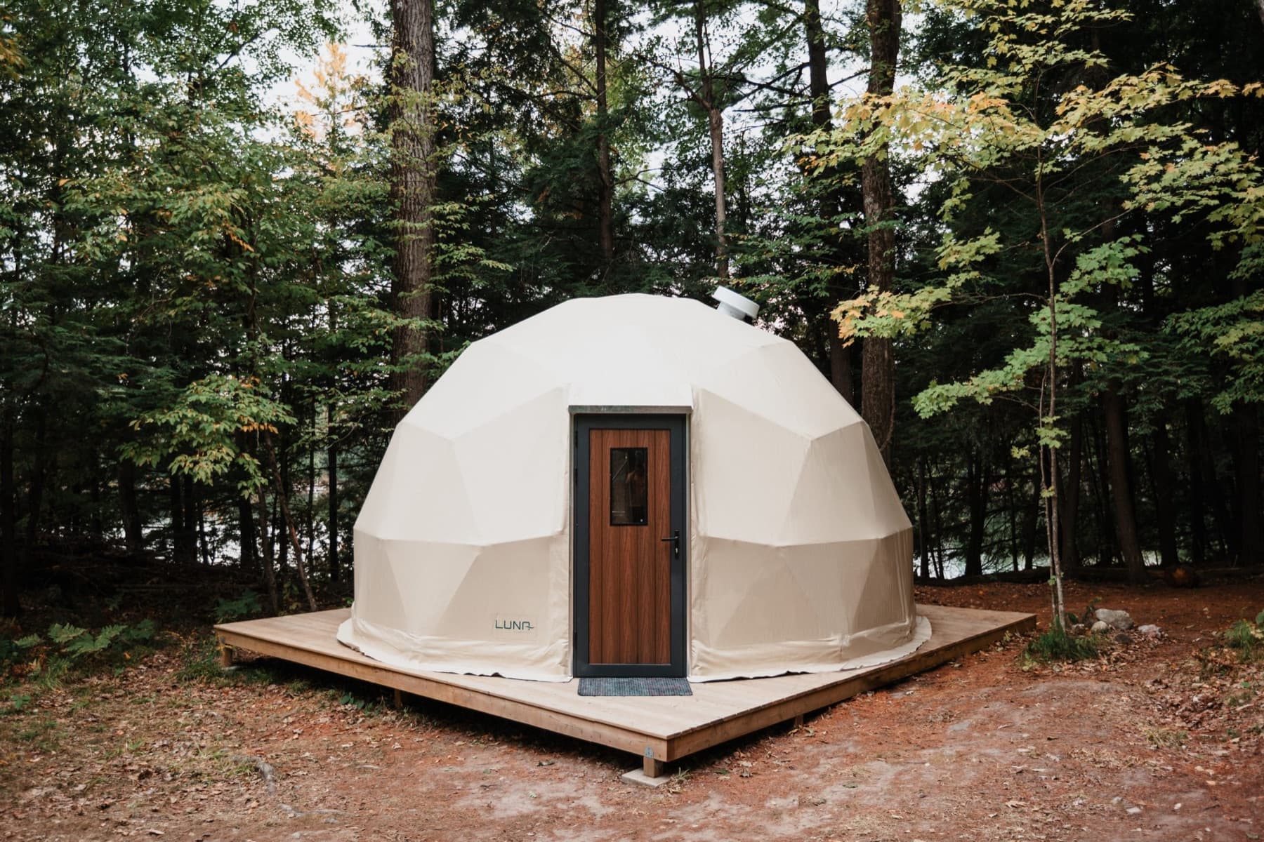 Luna dome on a timber deck in an Ontario forest